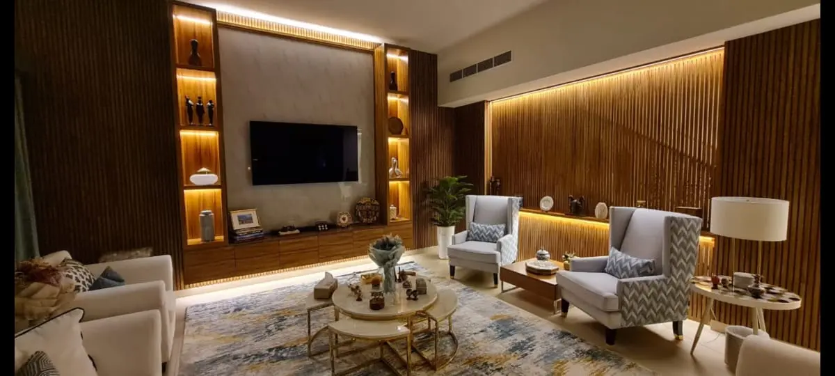 Warm walnut feature wall living room completed by renovation team